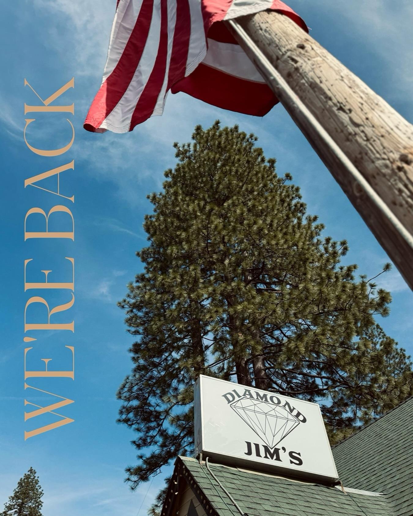 A photo of an American flag in front of Diamond Jim's restaurant.